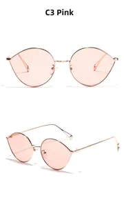 Gros plan de lunettes de soleil ovales roses avec monture fine en métal or rose et branches