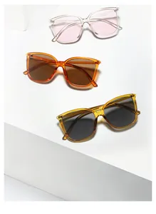 Three pairs of colorful Y2K oversized square sunglasses displayed on white geometric blocks
