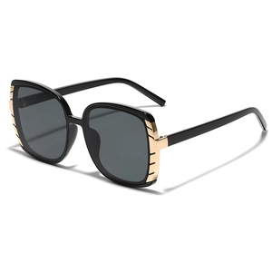Classic large square black frame sunglasses with gold metallic trim and gray lenses