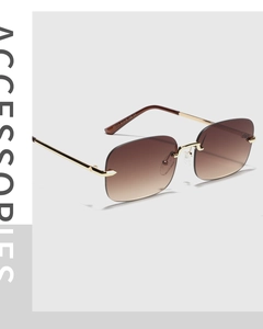 Detail shot of frameless Y2K square sunglasses with gradient lenses and golden metal temples