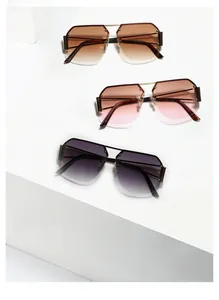 Close-up of rimless square sunglasses with gradient lenses and sleek metal frames