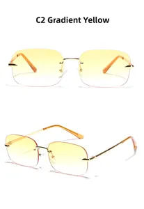 Detail of rimless Y2K square sunglasses with gradient yellow lenses and gold metal temples