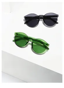 Detailed view of model 9371 rimless round sunglasses in dark gray and emerald green
