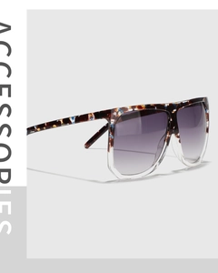 Detailed close-up of mixed-color square sunglasses with tortoise and transparent frames