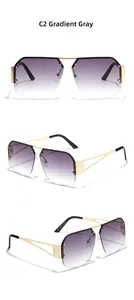 Detail view of rimless square sunglasses with gradient gray lenses and metal temples