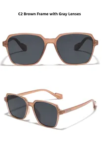 Detail of square tea-colored sunglasses with dark grey lenses and metal hinge studs