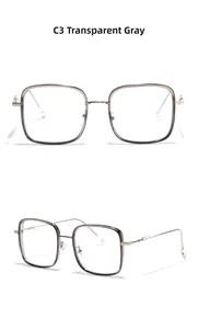 Detail view of transparent gray square TR90 frames with slim silver metal temples