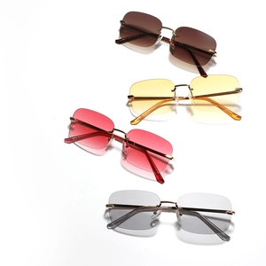 Rimless Y2K square sunglasses with gradient lenses and gold metal frames on white background