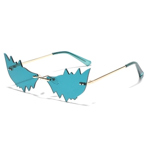 Lunettes de soleil Y2K bleues sans monture avec verres dentelés et cadre doré
