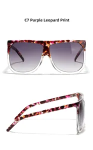 Detail of oversized square sunglasses featuring purple leopard print and gradient lenses