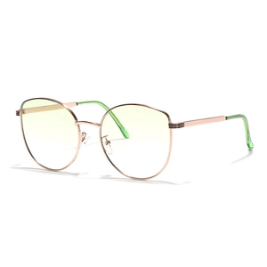Cat eye metal rose gold frames with light yellow lenses and green temple tips