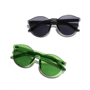 Frameless round candy-colored sunglasses in dark gray and bright green for men and women