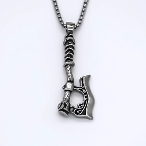 Viking style stainless steel axe pendant necklace with intricate embossed patterns on box chain