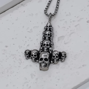 Gothic stainless steel Thor's hammer necklace featuring realistic skull relief carvings