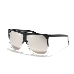 Oversized square flat top sunglasses with black and clear frames and silver mirror lenses