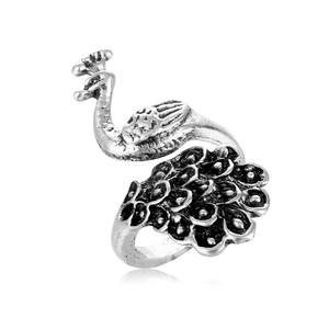 Vintage silver alloy peacock statement ring with intricate engraved details on white background
