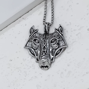 Punk style wolf mask pendant necklace in vintage stainless steel on a stone texture