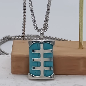 Modern silver box chain necklace featuring a rectangular turquoise inlay pendant