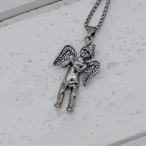 Vintage silver Cupid angel pendant necklace with detailed wings on a fine box chain