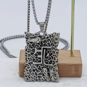 Industrial gothic square pendant necklace featuring a lava texture and engraved kanji