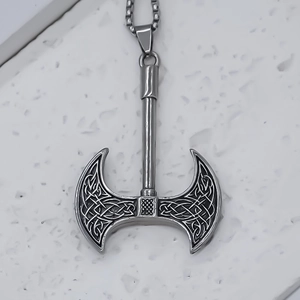 Macro detail of alloy double-edged battle axe pendant with intricate Celtic knot patterns