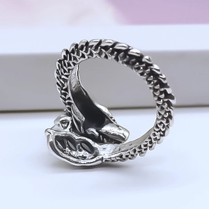 Macro shot of vintage silver dragon scale ring showing detailed texture and wrap design
