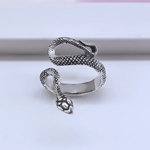 Close-up of vintage silver snake ring showing detailed scales and gothic animal design