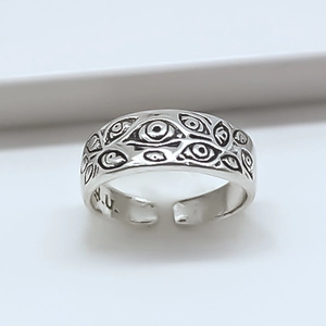 Adjustable silver evil eye ring with detailed multi-eye relief pattern for fashion