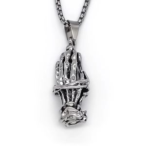 Retro silver praying hands pendant necklace with detailed engravings on a pearl chain