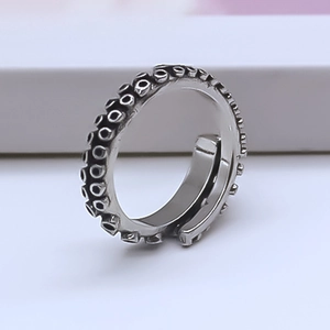 Macro detail of the vintage silver octopus tentacle ring showing suction cup textures
