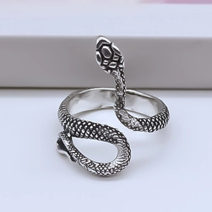 Close-up of vintage punk snake ring with textured scales and black oxide finish details