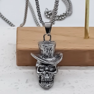 Vintage stainless steel skull necklace featuring a textured top hat and classic box chain