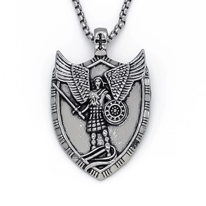 Vintage stainless steel shield pendant necklace featuring an embossed winged warrior