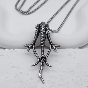 Detailed view of the dark snake pendant with intricate scales and matte silver finish