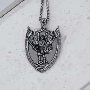 Retro stainless steel necklace with Archangel Michael shield pendant on white texture
