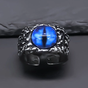 Vintage evil eye ring with blue cat eye stone and silver punk rock texture band