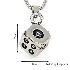 Punk silver dice pendant with skull details and ring bail on a white background
