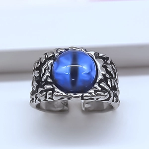 Vintage punk style adjustable devil eye ring with large blue stone and rock texture