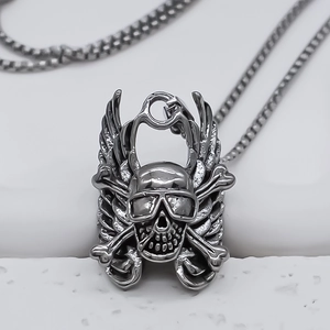 Detail of cyberpunk skull pendant with wings and sunglasses on a steel chain