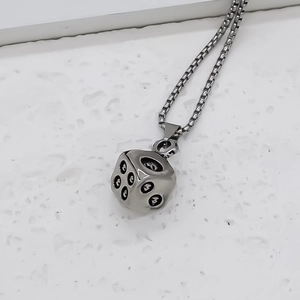 Punk style silver cube dice pendant necklace with black dots on a white box chain