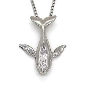 Minimalist silver whale pendant necklace with a polished box chain on white background