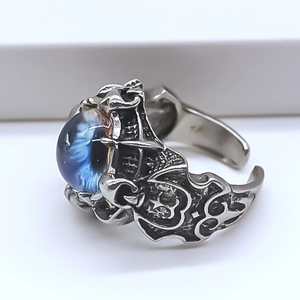 Macro shot of retro alloy devil eye ring featuring a detailed beast claw setting
