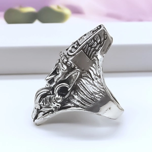 Retro punk style silver alloy ring featuring an embossed mythological figure totem
