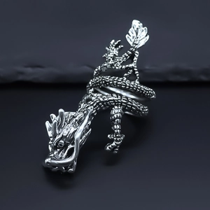 Macro detail of vintage silver dragon ring showing intricate scales and dragon head