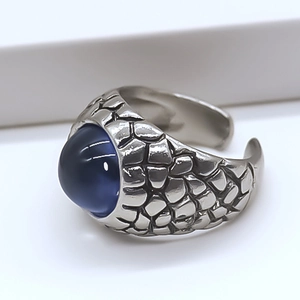 Detailed view of vintage blue eagle eye ring featuring textured dragon scales
