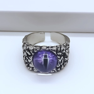Detail of gothic eagle eye ring featuring purple stone and rock texture alloy finish