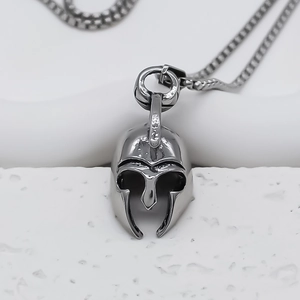 Detailed close-up of Spartan helmet pendant in steel finish with square box chain