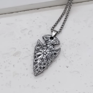 Vintage stainless steel arrow pendant necklace with Viking Vegvisir symbol on marble