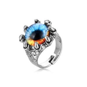 Detailed shot of vintage silver dragon claw ring with gradient blue and orange eyeball