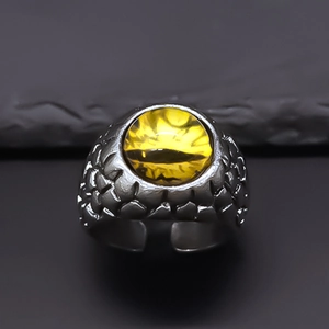 Vintage punk silver dragon scale ring featuring a striking yellow evil eye gemstone